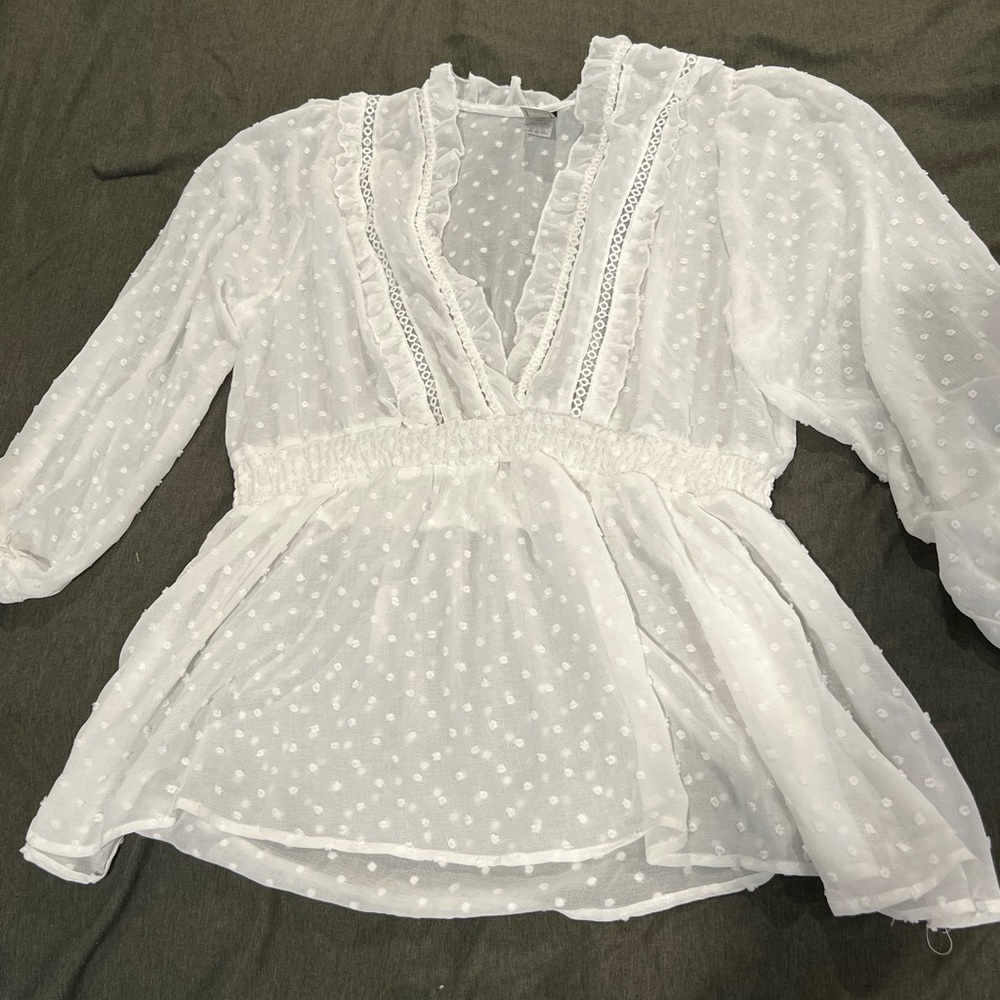 Sheer white blouse with long sleeves and really cute details!